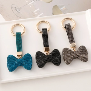 Schlüsselanhänger Set mit Strass Schleifen in Blau, Schwarz und Grau mit Goldring