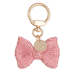 Sparkling pink rhinestone bow keychain with golden spring clasp and circular tag detail