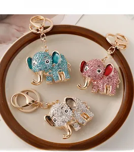 Detailed view of colorful rhinestone elephant keychains in blue pink and silver colors