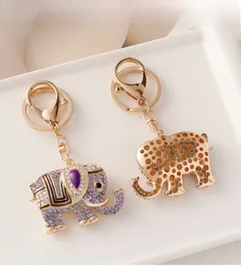 Detailed front and back view of crystal-encrusted elephant keychain with gold plating