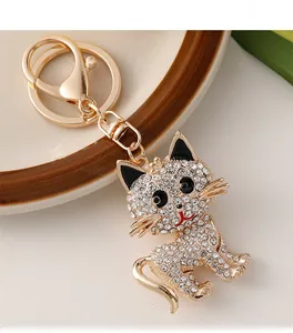 Macro view of gold cat keychain with shimmering rhinestones and standard lobster clasp