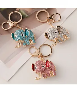 Detailed close-up of elephant keychains with colorful rhinestones and enamel accents