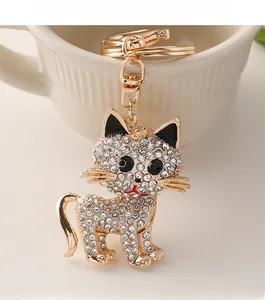 Detailed view of the sparkling rhinestone cat keychain with golden rotating swivel hook
