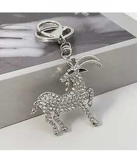 Detail view of goat zodiac keychain with sparkling white rhinestones and silver metal finish