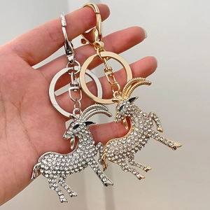 Sparkling crystal goat keychains in gold and silver alloy finish with lobster clasps