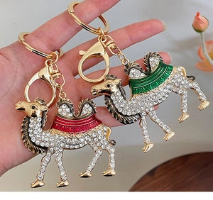 Detail of camel keychains with glittering rhinestones and colorful enamel accents