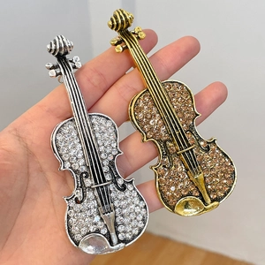 Elegant violin-shaped keychains with sparkling rhinestones in gold and silver finish