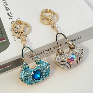 Exquisite crystal handbag keychains with heart-shaped diamonds in blue and silver colors
