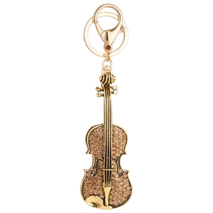 Golden violin keychain with champagne crystals and lobster clasp on white background