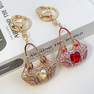 Exquisite handbag-shaped heart keychain with sparkling crystals and golden clasp