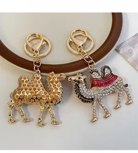 Detail of camel keychains with hollow heart pattern and rhinestone studded crystals