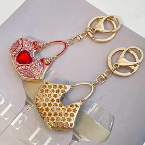 Pink rhinestone handbag keychain set with heart crystal and golden floral pattern charm
