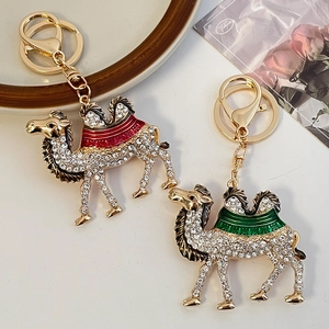 Sparkling crystal camel keychain set with colorful enamel saddles on gold-tone metal