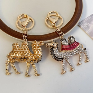 Creative cartoon diamond camel keychain with hollow heart design and golden plating