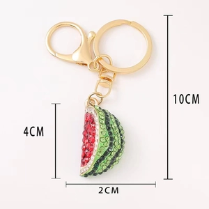 Sparkling watermelon crystal keychain with gold hardware and rhinestone details, 10cm length
