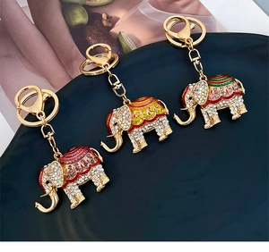 Three crystal elephant keychains in gold metal finish with colorful enamel and rhinestones