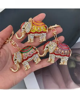 Detailed close-up of elephant keychains with crystals and colorful enamel patterns