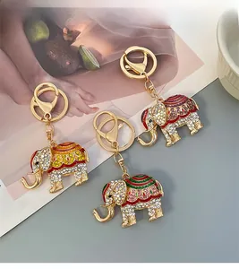 Three crystal elephant keychains with colorful enamel details and sparkling rhinestones