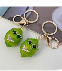 Detailed macro view of the green lime keychain with cool sunglasses and sparkling rhinestones