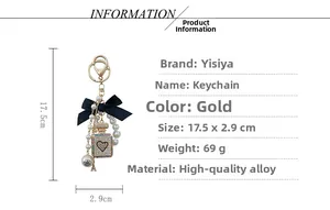 Detail view of pearl bow keychain with rhinestone perfume bottle charm and dimensions