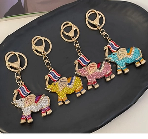 Detailed set of four metallic elephant keychains with colorful rhinestones and lobster clasps