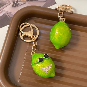 Creative green lemon keychain with sunglasses and rhinestone smiley face charm for car keys