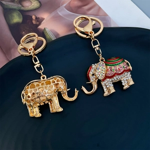 Charming metal elephant keychain with sparkling rhinestones and hollow heart patterns