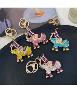 Detailed close-up of elephant keychains with colorful rhinestones and Thailand flags