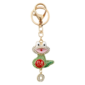 Golden Chinese zodiac snake keychain with green rhinestones and fortune coin pendant