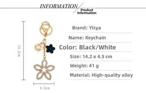 Detail view of lucky clover keychain with sparkling rhinestones and golden alloy finish