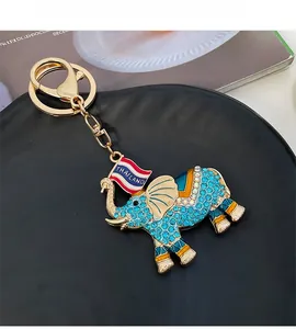 Detail of Thai elephant keychain with blue rhinestones and gold metal lobster clasp