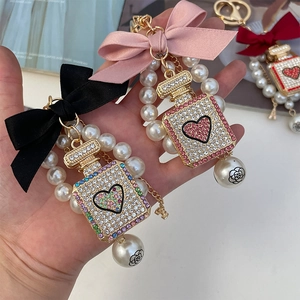 Luxury perfume bottle keychain with handmade bow, pearls and diamonds for women bags