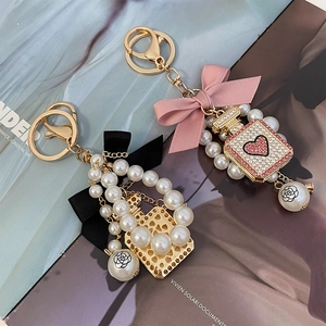 Bowknot pearl keychain with rhinestone perfume bottle pendant for women handbags