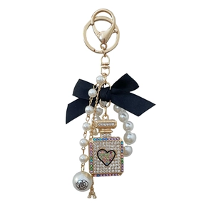 Luxury keychain with pearl bow, crystal perfume bottle and Eiffel Tower charm