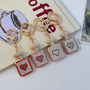 Fashion perfume bottle keychains with heart patterns and sparkling rhinestones