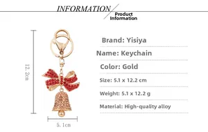 Detailed size view of red bow and gold bell keychain with sparkling rhinestones