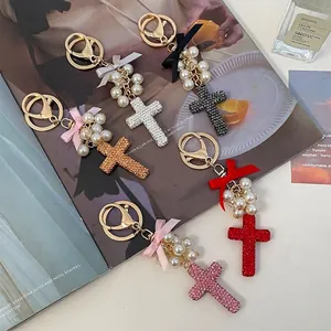 Bow pearl cross keychain collection with rhinestones in multiple colors for bags