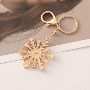 Porte-clés flocon de neige de Noël doré avec strass brillants et fermoir mousqueton