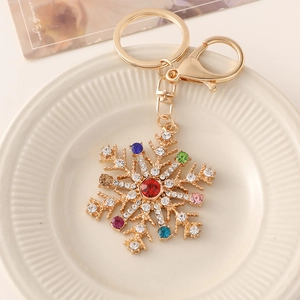 Porte-clés flocon de neige en strass colorés avec base dorée et fermoir mousqueton