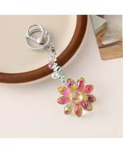 Macro shot of gradient crystal sunflower keychain with sparkling faceted petal details