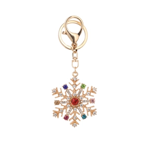 Porte-clés flocon de neige doré avec cristaux colorés et strass rouge central
