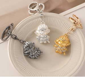 Detailed trio of Monkey King keychains in gunblack, silver, and gold crystal finish