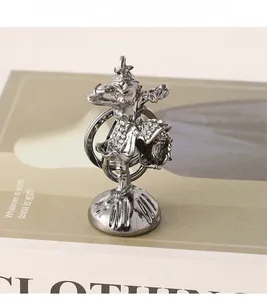 Detail of Sun Wukong metal keychain with vintage silver finish and rhinestone armor