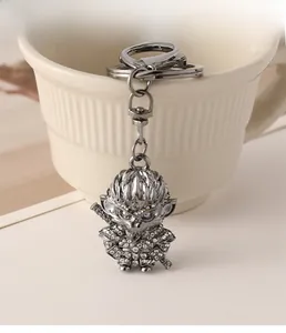 Detail of Sun Wukong keychain in gunmetal finish with sparkling rhinestones on ceramic cup