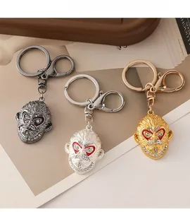 Detailed view of Monkey King keychains in gold, silver, and gunmetal with crystals