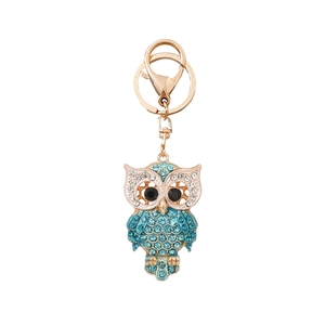 Sparkling owl keychain with blue rhinestones and gold-plated metal clasp for handbags
