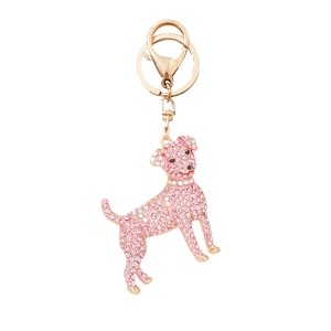 Pink rhinestone dog keychain with gold metal plating and lobster clasp on white background