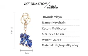 Detail of blue enamel elephant keychain with white rhinestones and golden alloy finish