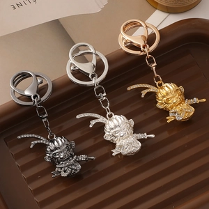 Porte-clés Roi Singe en métal or, argent et noir avec des strass en cristal étincelants