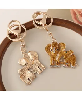 Detailed view of golden elephant keychain brooch with sequins and sparkling rhinestones